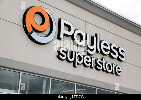 A logo sign outside of a Payless ShoeSource retail store in Mississauga, Ontario, Canada, on April 16, 2017. Stock Photo