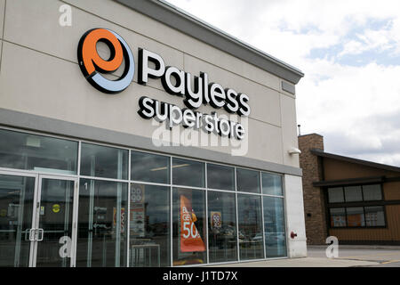 A logo sign outside of a Payless ShoeSource retail store in Mississauga, Ontario, Canada, on April 16, 2017. Stock Photo