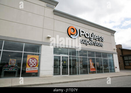 A logo sign outside of a Payless ShoeSource retail store in Mississauga, Ontario, Canada, on April 16, 2017. Stock Photo