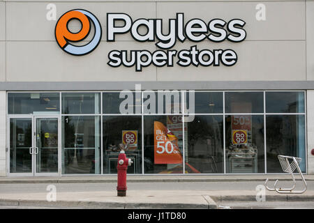 A logo sign outside of a Payless ShoeSource retail store in Mississauga, Ontario, Canada, on April 16, 2017. Stock Photo