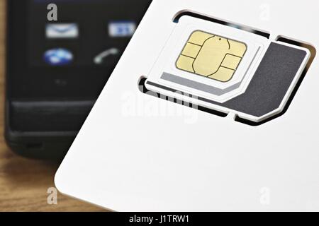 triple SIM card for mobile communication Stock Photo