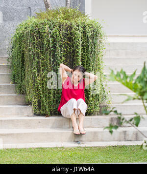 Woman Tying Hair on Park Stock Photo