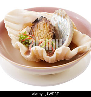 Shell of sauteed fried abalone with onion on bowl Stock Photo