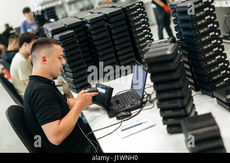 Worker using barcode reader to identify product Stock Photo