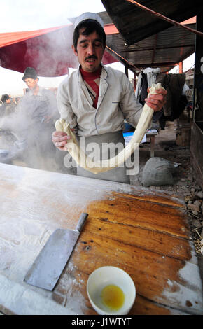 Hand pulled noodles preparation. Stock Photo