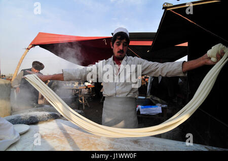 Hand pulled noodles preparation. Stock Photo