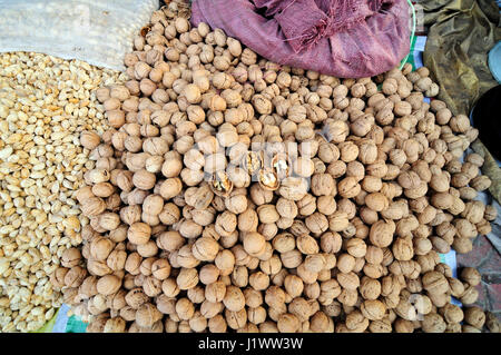 A pile of walnuts on display in the market in Kashgar. Stock Photo