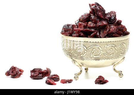 dried cranberries in a silver bowl isolated on white background Stock Photo