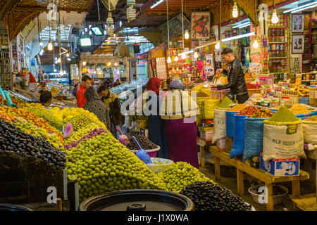 Meknes, Morocco - March 04, 2017: Traditional market with olives, pickled lemons, fruit and candy in Medina Meknes Stock Photo