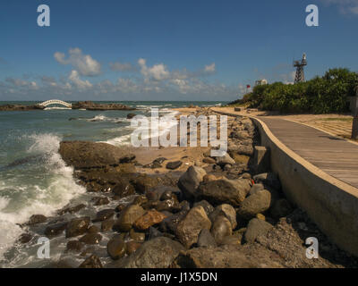 Shimen, Taiwan - October 03, 2016: A white bridge between the rocks on the shore of the ocean in Shimen Art, northern Taiwan Stock Photo