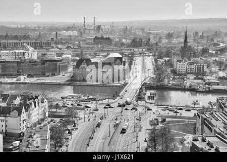 Szczecin, Poland - April 01, 2017: Black and white aerial view of the city downtown with bridge over Odra river. Stock Photo