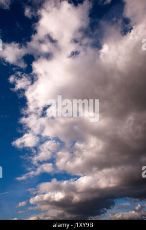 Cumulus clouds in blue sky fairweather clouds on a bright sunny day Stock Photo