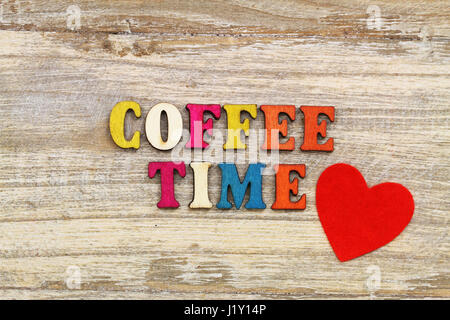 Coffee time written with colorful wooden letters and red heart Stock Photo