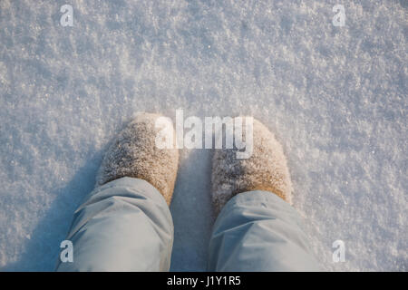 Legs, winter boots on snow in winter, Russia Stock Photo