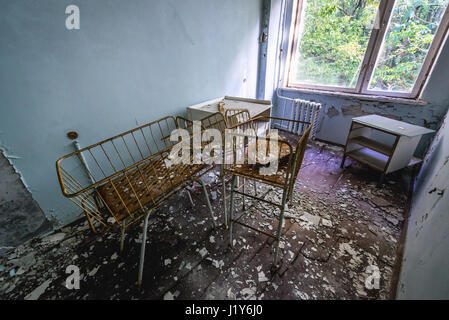 Maternity ward in Hospital No. 126 of Pripyat ghost city, Chernobyl Nuclear Power Plant Zone of Alienation around nuclear reactor disaster, Ukraine Stock Photo