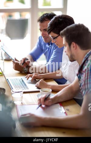 businessman using laptop in coffee shop Stock Photo