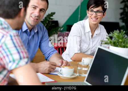 Business people using break in coffee shop Stock Photo