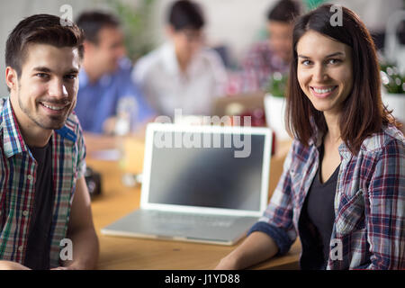 Young couple web surfing with laptop Stock Photo