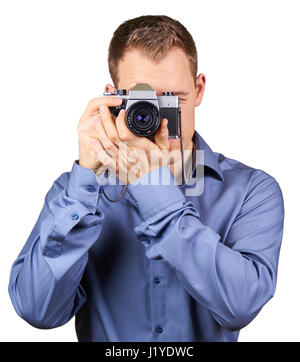 Handsome young man holding a vintage camera. Isolated Stock Photo