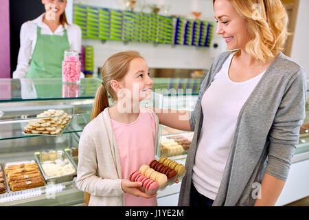 Young mother with daughter in beautiful pastry shop Stock Photo