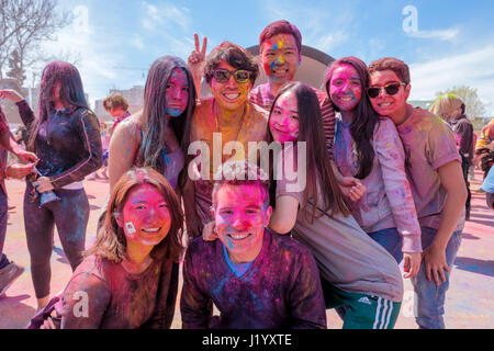 London, Ontario, Canada, 22nd Apr, 2017. A group of teenagers posing for a picture at Victoria Park during the Holi Spring Festival, also known as Rangwali Holi, Dhuleti, Dhulandi, Phagwah, or simply as Festival of Colours, an Hindu festival to celebrate the arrival of Spring in London, Ontario, Canada. Credit: Rubens Alarcon/Alamy Live News. Stock Photo