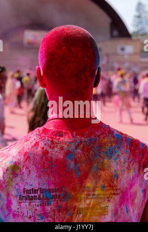 London, Ontario, Canada, 22nd Apr, 2017. Male oriental teenager covered in colourful powder at Victoria Park during the Holi Spring Festival, also known as Rangwali Holi, Dhuleti, Dhulandi, Phagwah, or simply as Festival of Colours, an Hindu festival to celebrate the arrival of Spring in London, Ontario, Canada. Credit: Rubens Alarcon/Alamy Live News. Stock Photo