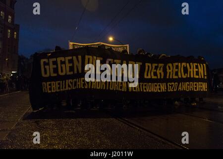 Berlin, Berlin, Germany. 22nd Apr, 2017. Several hundred demonstrators gathered for the 'interkiezionale' demonstration through the Berlin districts Friedrichshain, Kreuzberg and NeukÃ¶lln to protest against displacement, gentrification, the loss and housing, business space as well as against eviction. A broad alliance of local residents' initiatives, project groups, house communities and political groups had previously called for the demonstration. The demonstrators held banners with the inscription, ''Against the City of the Rich!''. Fireworks were thrown out of the demonstration occasiona Stock Photo