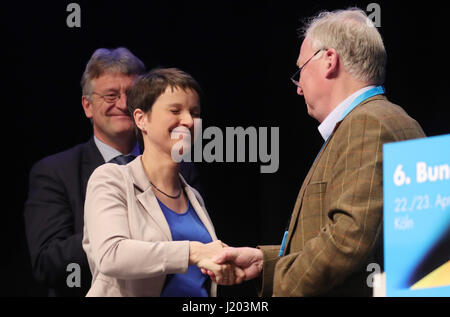 Cologne, Germany. 23rd Apr, 2017. RECROP - Alexander Gauland, member of the federal management board of the AfD, shakes the hand of party chairwoman Frauke Petry on stage at the Alternative fuer Deutschland party's national convention in the Maritim Hotel in Cologne, Germany, 23 April 2017. The rightist-nationalist vice chairman of the party Alexander Gauland and the liberal Alice Weidel will lead the AfD party into the national elections. Photo: Michael Kappeler/dpa/Alamy Live News Stock Photo