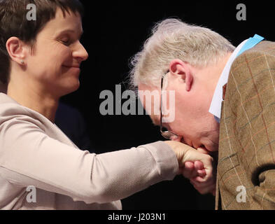 Cologne, Germany. 23rd Apr, 2017. RECROP - Alexander Gauland, member of the federal management board of the AfD, kisses the hand of party chairwoman Frauke Petry on stage at the Alternative fuer Deutschland party's national convention in the Maritim Hotel in Cologne, Germany, 23 April 2017. The rightist-nationalist vice chairman of the party Alexander Gauland and the liberal Alice Weidel will lead the AfD party into the national elections. Photo: Michael Kappeler/dpa/Alamy Live News Stock Photo