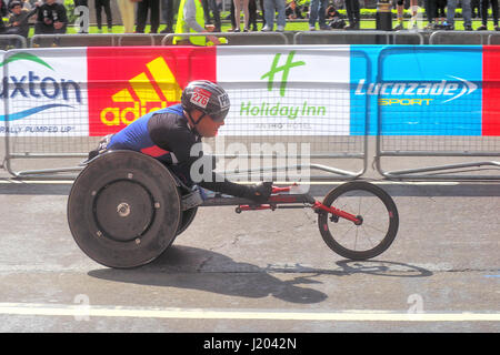 London, UK. 23rd Apr, 2017. A participant in the wheelchair section nears the finish line of the 2017 London marathon. Credit: Brian Minkoff/Alamy Live News Stock Photo