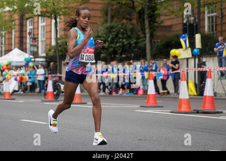 London, UK. 23rd Apr, 2017. Mare Dibaba of Ethiopia runs through Shadwell close to the halfway point of the 2017 Virgin Money London Marathon. Credit: Mark Kerrison/Alamy Live News Stock Photo