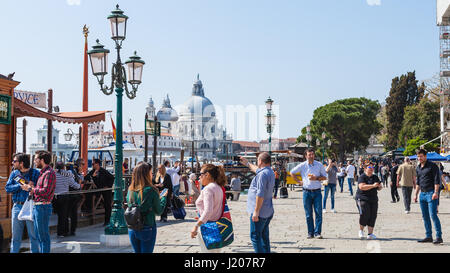 VENICE, ITALY - MARCH 30, 2017: tourist on promenade Riva degli Schiavoni on St Mark's Square (Piazza San Marco) in Venice city in spring. Piazza San  Stock Photo