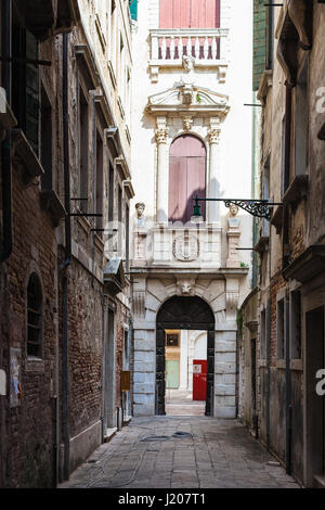 VENICE, ITALY - MARCH 30, 2017: Entrance to Museo di Palazzo Grimani on narrow street Ramo Grimani in Castello district in Venice city. The Palace bec Stock Photo