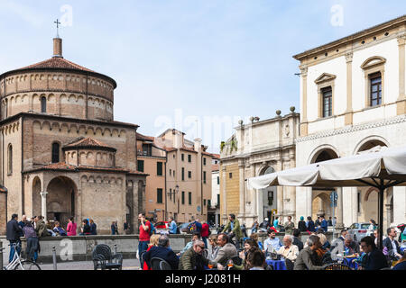 PADUA, ITALY - APRIL 1, 2017: tourists in outdoor cafe on Piazza Duomo near Cathedral in Padua city in spring. The first church on this place was erec Stock Photo