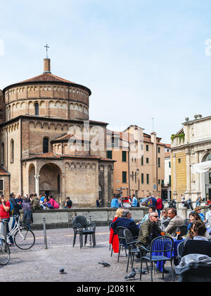 PADUA, ITALY - APRIL 1, 2017: people in outdoor cafe on Piazza Duomo near Cathedral in Padua city in spring. The first church on this place was erecte Stock Photo