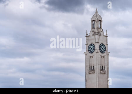 Close-up of Clock Tower over cloudy sky in Montreal Stock Photo