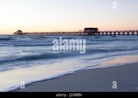 Silhouette of the fishing pier in Naples at sunset. Florida, United States Stock Photo