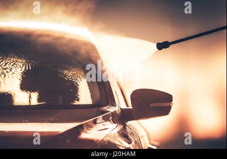 Washing Vehicle in Car Wash Using Manual High Pressure Nozzle. Stock Photo