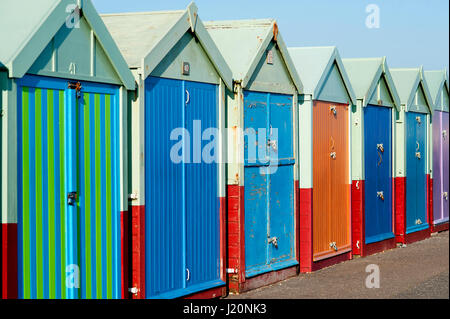 Multicoloured beach huts along the seafront in Hove on the Sussex coast, England. Stock Photo