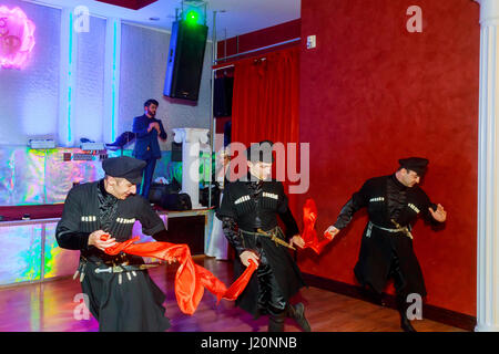 April 01 2017 NewYork NY USA: Georgian dancers dancing a folklore dance show on stage Georgian national dances Stock Photo