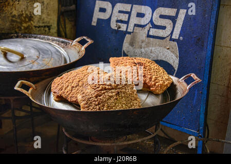 Moo krob, crispy deep fried pork belly, Nang Loeng market in Bangkok, Thailand