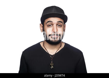 Portrait of young sad unhappy man with black t-shirt and cap looking at camera. studio shot, isolated on white background. Stock Photo