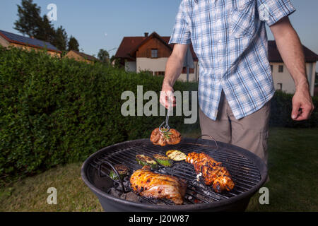 grill cooking out in the backyard Stock Photo