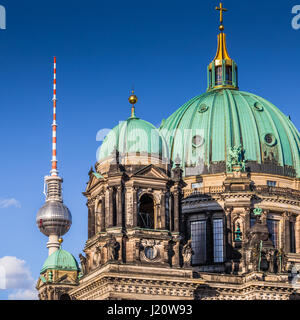 Closeup panorama view of historic Berlin Cathedral with famous TV tower in the background on a beautiful sunny day with blue sky and clouds in summer, Stock Photo