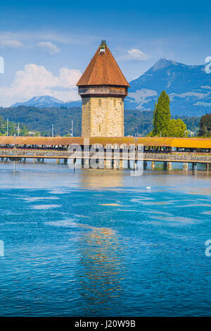 Historic city center of Lucerne with famous Chapel Bridge, the city's symbol and one of the Switzerland's main tourist attractions, in summer Stock Photo