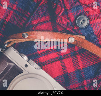 Rustic Plaid Shirt With Retro Vintage Camera And Leather Strap Stock Photo