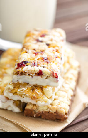 Delicious granola bars with oat, honey and yogurt, healthy food for breakfast. Homemade cereal snacks for healthy eating Stock Photo