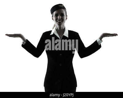 one caucasian Stewardess cabin crew  woman hands open isolated on white background in  silhouette Stock Photo