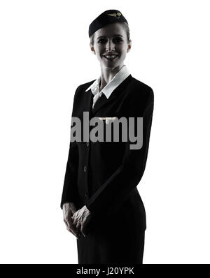 one caucasian Stewardess cabin crew  woman standing  isolated on white background in  silhouette Stock Photo