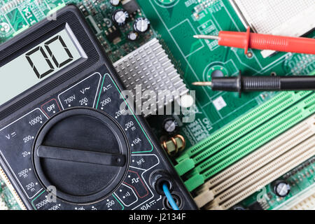 Electronic measuring tool close-up on a computer board Stock Photo